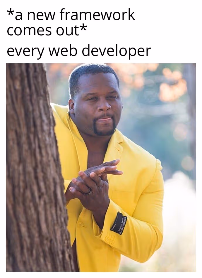 Anthony Adams rubbing hands together behind a tree